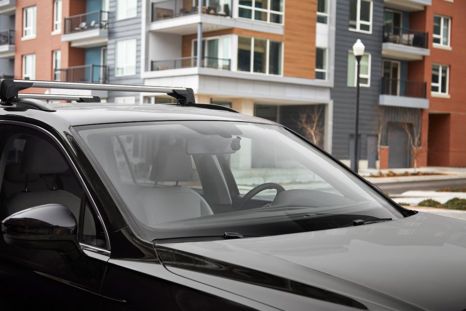 A black car equipped with Garmin dash cam.
